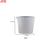 A white flexible silicone measuring cup with a 3.7cm height and a capacity of 30ml.