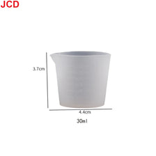 A white flexible silicone measuring cup with a 3.7cm height and a capacity of 30ml.
