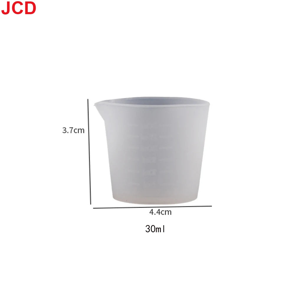 A white flexible silicone measuring cup with a 3.7cm height and a capacity of 30ml.
