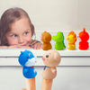 A collection of ten soft rubber animal finger puppets in various colors, including orange, green, yellow, and red, displayed 