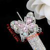 Silver crystal butterfly beads with pink accents and a glittery cylindrical component for jewelry making