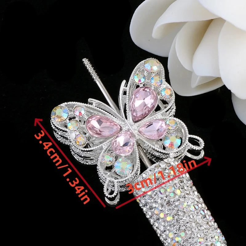 Silver crystal butterfly beads with pink accents and a glittery cylindrical component for jewelry making