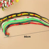 A display of colorful rubber snakes of varying lengths and patterns laid out on a light background.