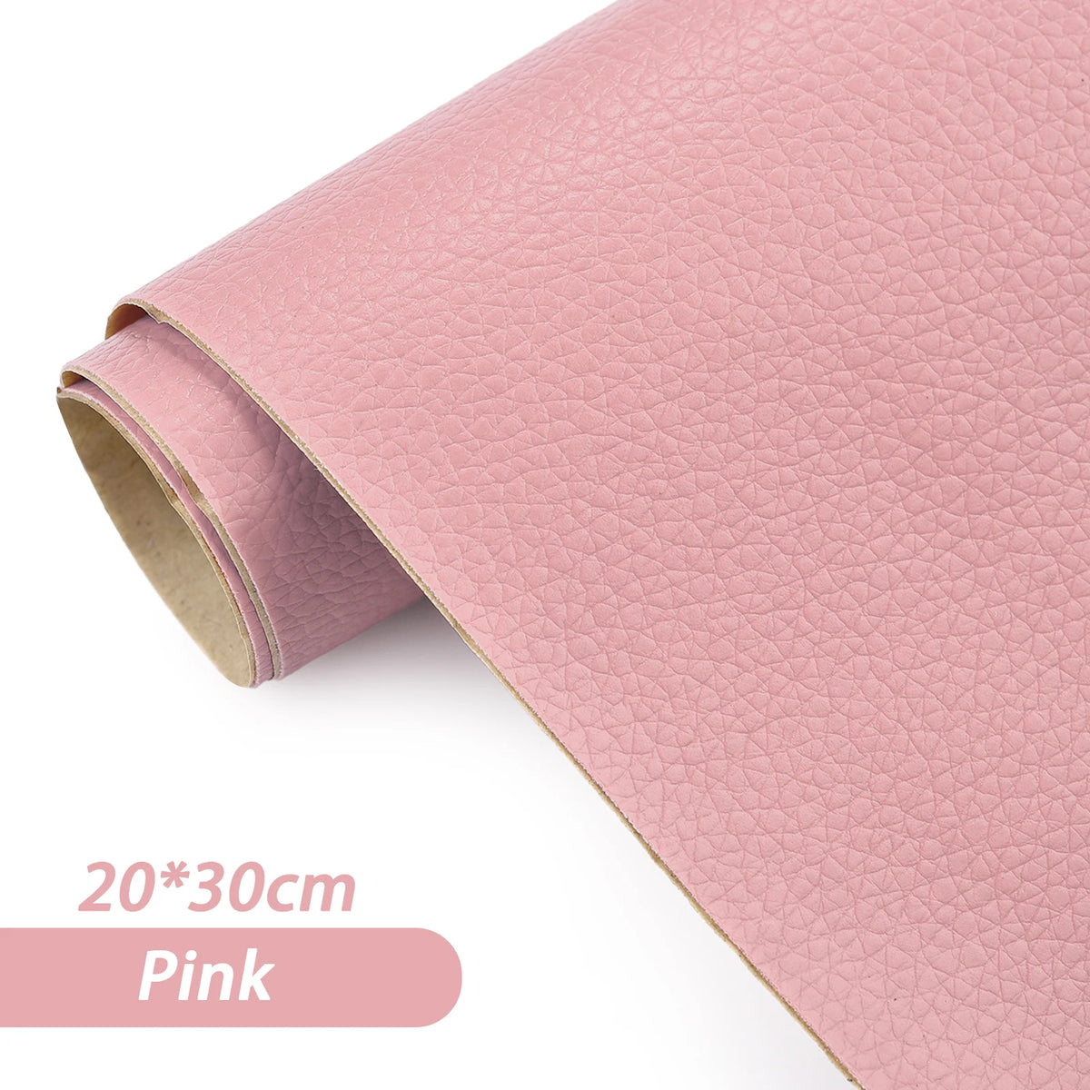 Pink self-adhesive PU leather repair patches rolled up on a surface