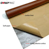 A roll of brown kraft paper is being covered with a leather front using a strong adhesive surface.