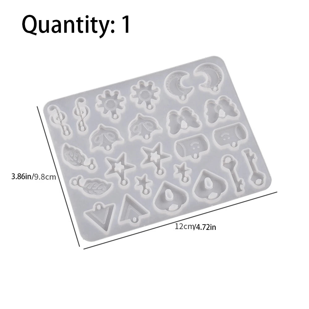 A silicone mold tray containing various heart-shaped and decorative metal-style shapes for resin casting.