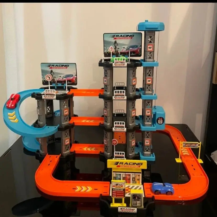 A multi-level racing track set featuring a car and a parking garage structure.