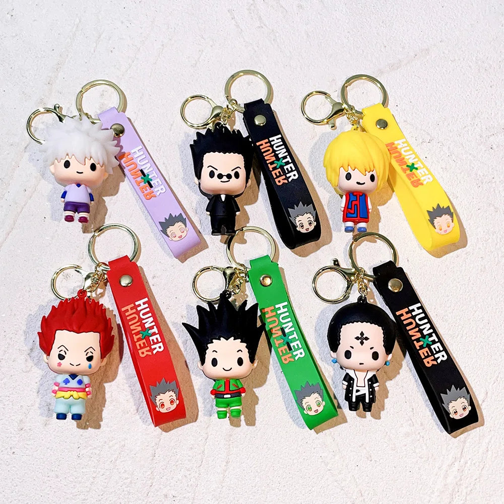 A collection of resin keychains featuring various Hunter x Hunter anime characters in different colors and poses.