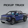 A dark blue Ford pickup truck diecast model with black accents and a light bar.