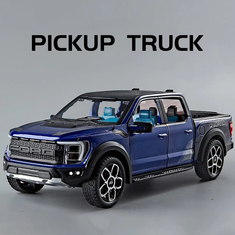 A dark blue Ford pickup truck diecast model with black accents and a light bar.