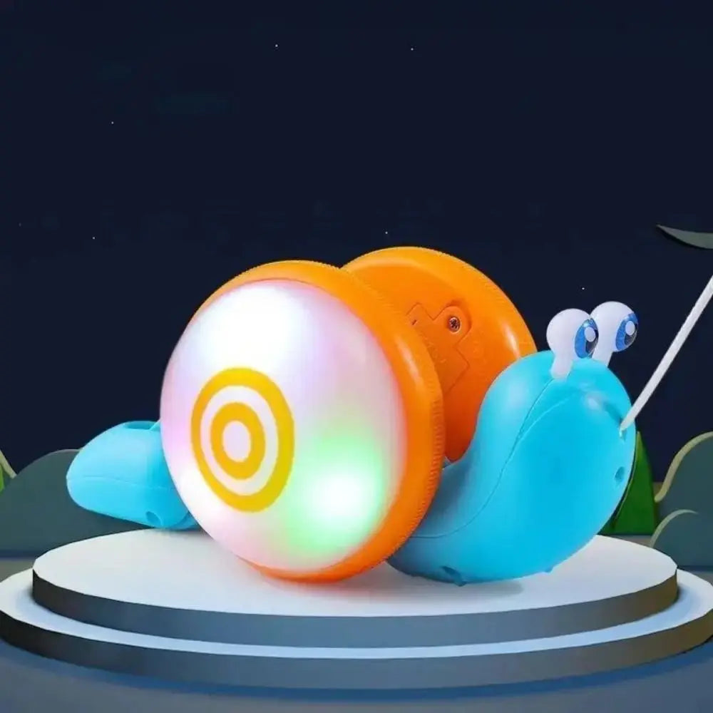 An orange and white musical pull-along snail toy is featured against a dark background.