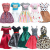 A collection of handmade casual doll outfits featuring various colors and patterns including leopard print, pink, gray, and r