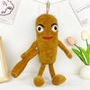 A brown, plush shark toy with large eyes and a smiling face is displayed against a white background.