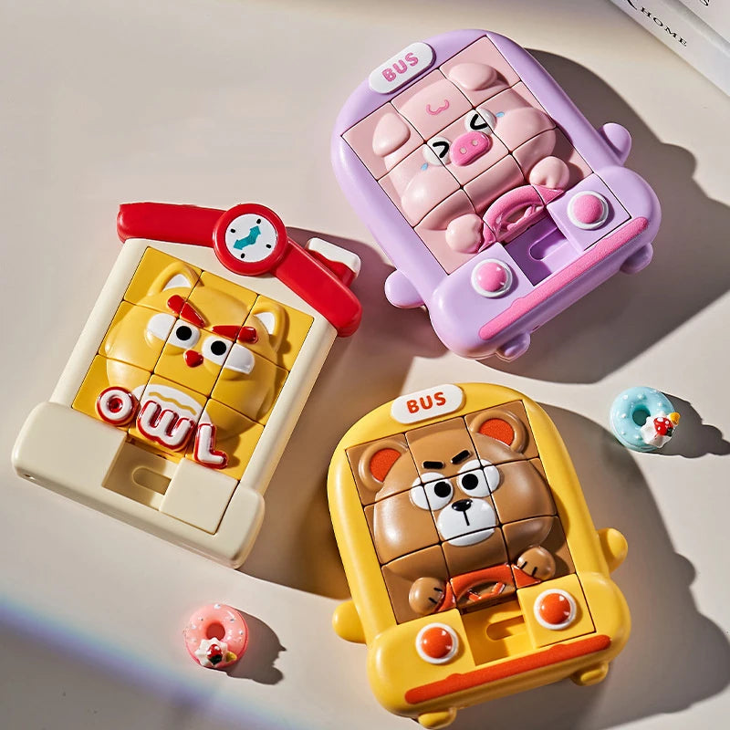 A set of three animal slide puzzles featuring a pig, an owl, and a bear in pink, yellow, and orange colors.