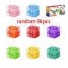 A collection of 96 transparent magnetic building blocks in various colors including pink, blue, red, purple, green, and yello