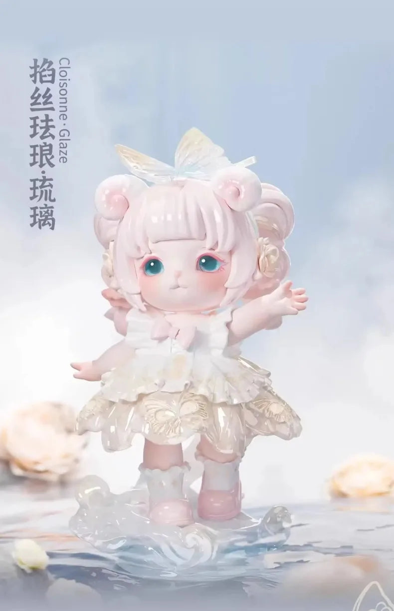 A pink collectible figurine of a girl with fluffy hair and a white dress floating on a reflective surface.