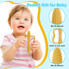 A baby is shown holding a yellow silicone teether designed for biting and gripping.