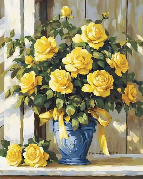 A bouquet of yellow roses and sunflowers in a blue vase on a wooden surface.