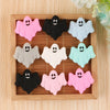 A set of five silicone ghost beads in various pastel colors are arranged in a wooden tray.