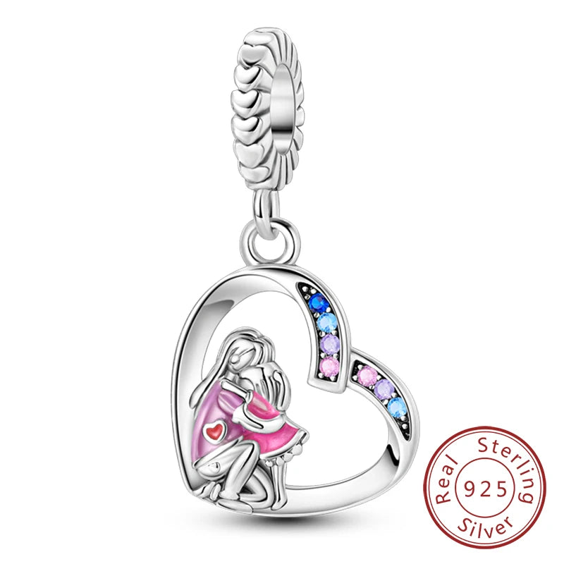 Sterling silver heart charm bead featuring a silhouette of a mother and child.