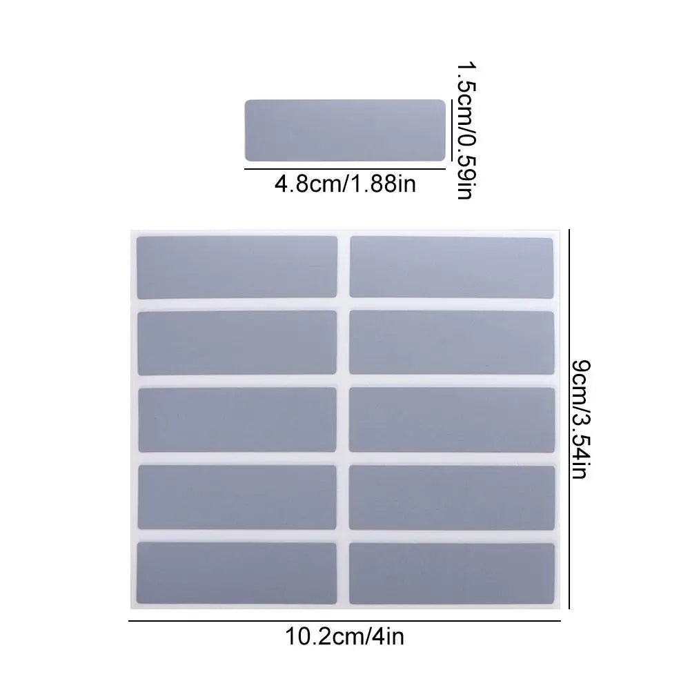 A sheet of light gray scratch-off sticker material with multiple rectangular sections for DIY cards and games.