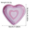A light purple heart-shaped metal rolling tray with a recessed heart design.