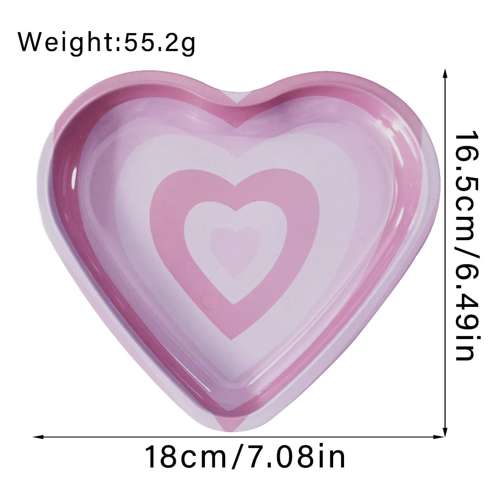 A light purple heart-shaped metal rolling tray with a recessed heart design.