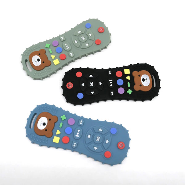 Three silicone remote control teethers for babies in green, black, and blue colors