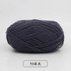 A ball of dark gray pre-dyed milk cotton yarn used for knitting and crochet.