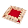 A wooden dice game set with numbered wooden dice inside a wooden box