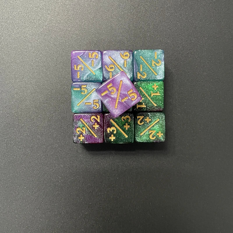 A set of ten dual-color counting dice showing positive and negative numbers.