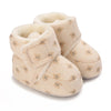 Pair of beige fuzzy baby winter cartoon boots with a soft non-slip sole