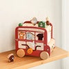 A wooden animal tourism bus Montessori busy board for toddlers featuring various animals and elements.