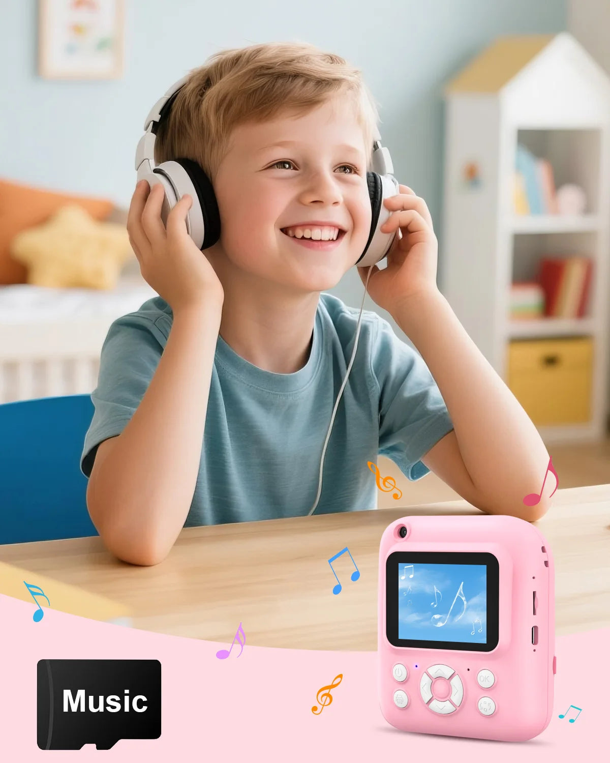 A young boy is smiling while using a pink instant print camera with headphones.