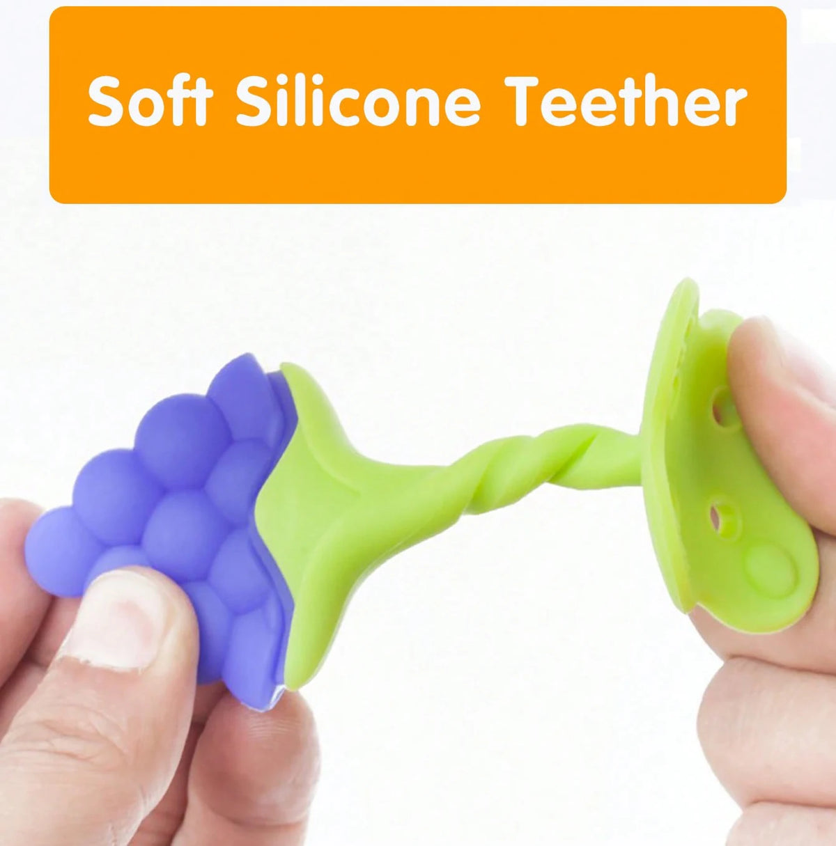 A hand holds a soft silicone fruit-shaped baby teether with purple and lime green silicone parts.