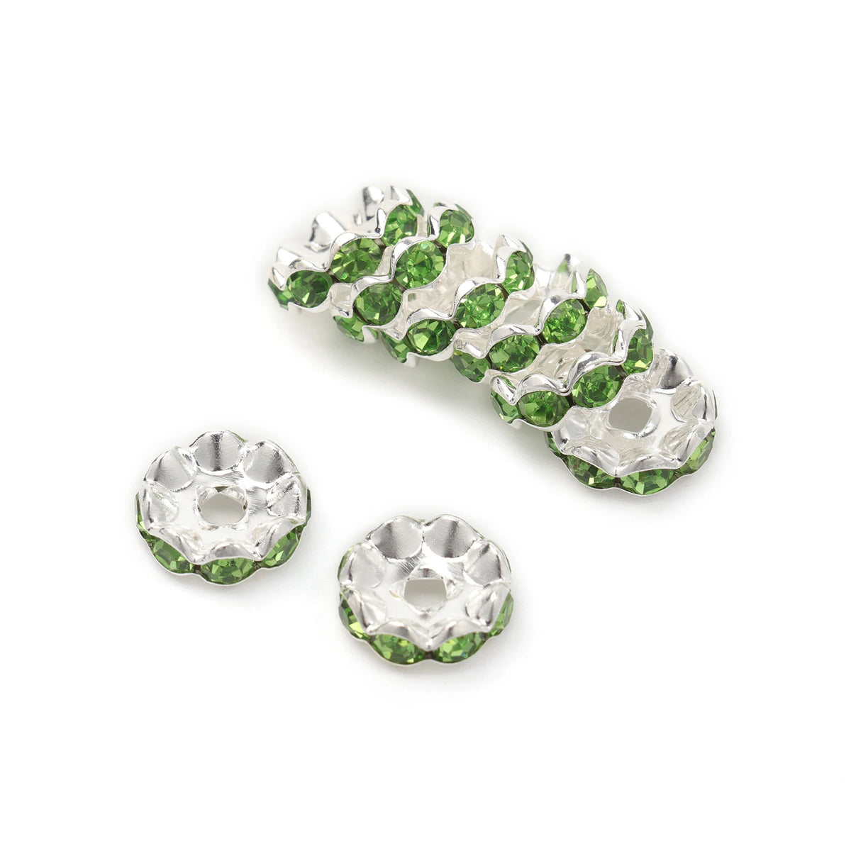 A cluster of 12mm crystal rhinestone spacer beads in green and clear pave setting.