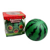 A box and a green watermelon-themed squishy stress ball with black stripes.