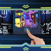 A hand touches a wooden book nook kit featuring cyberpunk-themed scenes and glowing circuit board details.