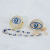 Gold and blue evil eye pacifier and clip set with a large eye charm