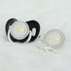 A black silicone pacifier clip with a white rhinestone nameplate spelling Sophia