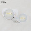A set of white rhinestone pacifiers and clips with the name Sophia engraved on them