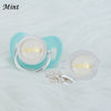 A set of custom name rhinestone pacifiers and clips in light blue and white.