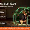 A child is using a glowing geometric structure made of rods to light up a dark room.